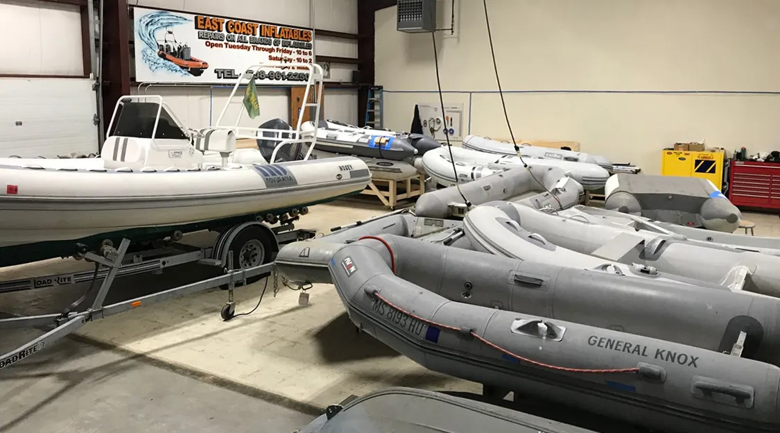 Inflatable boats inside repair workshop