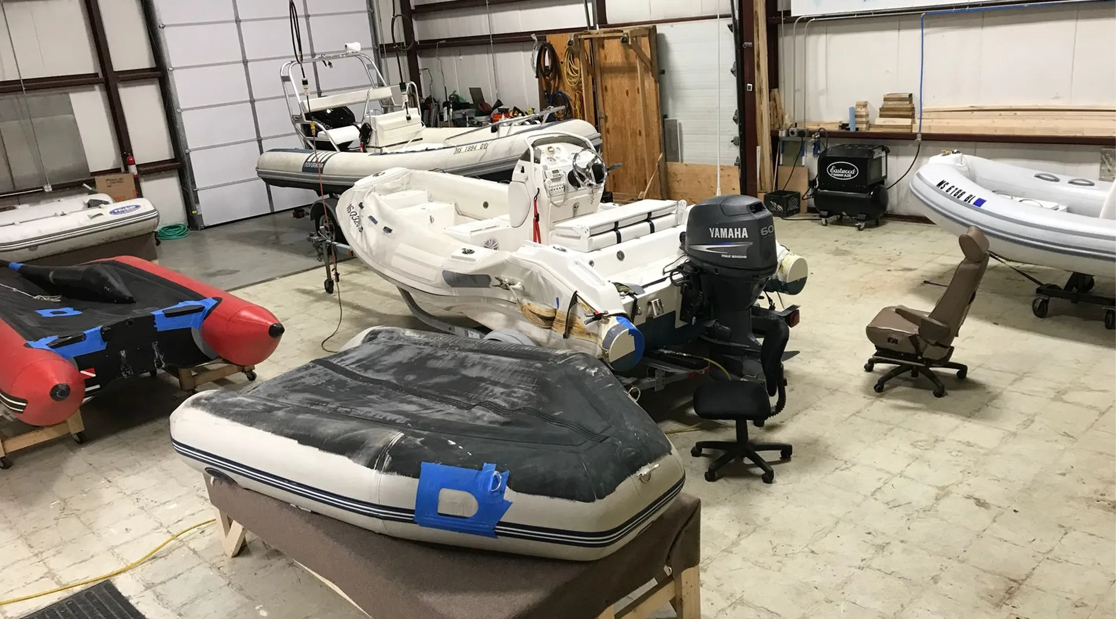 Inflatable boat undergoing repair work
